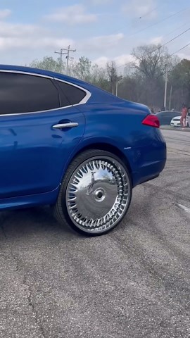 Blue Infiniti M37 on 28” DUB floaters