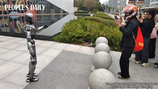 64K views · 294 reactions | A made-in-China humanoid robot has become an instant celebrity as it showed off its natural human-like gait coupled with greetings to passersby. The 138-cm-tall robot weighs about 40 kg and can walk at a speed of 2 meters per second. | People's Daily, China | Facebook