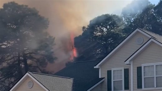 Flames and smoke surround homes in Myrtle Beach, South Carolina