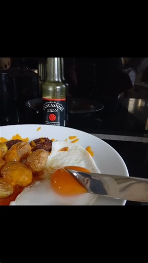 Cheesey air-fried new potatoes with plum tommies, black pudding and fried runny duck egg #breakfast #brunch #lancashiresauce | Grandma Entwistle's Lancashire Sauce
