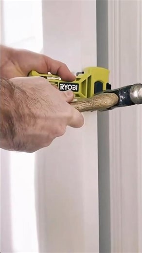 What tool should I use to prepare for the installation of a door hinge?