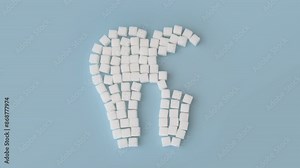 Tooth made from sugar cubes, the sugar cubes slowly disappear causing a growing hole in the tooth. Stop Motion animation of a spreading tooth disease.