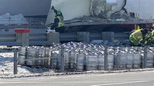 Semi-truck full of beer kegs crashes