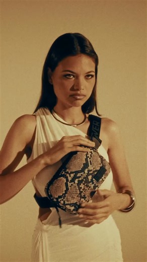 WOLFpak®️ on Instagram: "She doesn’t wait for permission. She moves with purpose. Strength isn’t loud ,it’s worn. The Python Bag drops Friday 🐍 #wolfpak NEVER AVERAGE ALWAYS A WOLF WINNERS WEAR WOLFPAK"