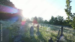 Graveyard drone shots. Tombs in a large cemetery with walkways between sections - aerial view. hover above a cemetery with gravestones