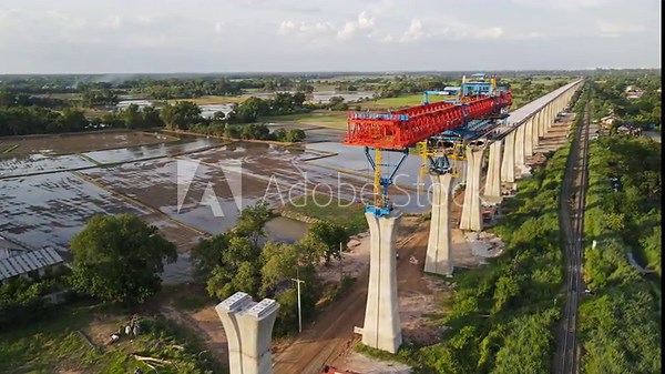 Construction of a high-speed elevated railway using cranes for the Bangkok to Nakhon Ratchasima high-speed rail project.