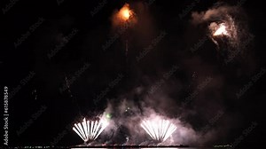 Real fireworks background. Firework Display, abstract blur of real golden shining fireworks lights at night sky. glowing fireworks show. Firework Explosive Material. New year's eve fireworks