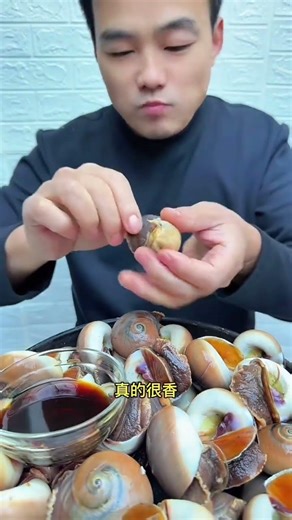 Preparing New Year’s goods Cat’s eye snail seafood