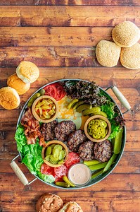 ☀️🍔🥒 Summertime dinners are more fun with a burger board! Try one at your next cookout! | Mt. Olive Pickles