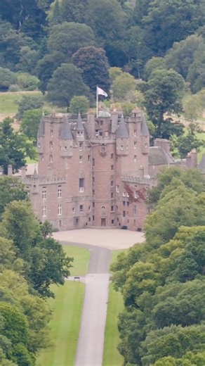 Glamis Castle, nestled in the lush Angus countryside of Scotland, is a breathtaking baronial fortress and ancestral home of the Earls of Strathmore. Dating to the 14th century, its fairy-tale turrets and sandstone walls exude medieval charm, famously linked to Shakespeare’s Macbeth as the Thane’s residence. Legend claims it harbors ghostly tales and secret chambers. Expanded in the 17th and 18th centuries, it features opulent interiors with royal portraits, tapestries, and the childhood rooms of