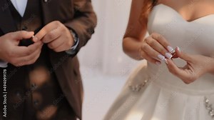 bride and groom exchange rings. sign of love at wedding. Slavic Ukrainian Russian traditions. ceremony take rings hold in their hands worrying.