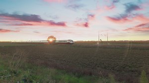 High speed train passing in a beautiful sunset - Free Stock Video