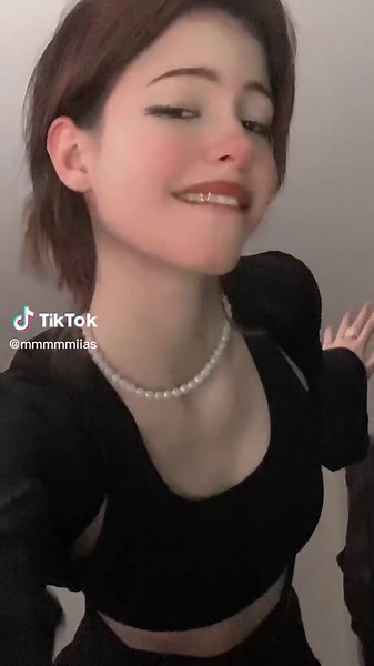 Stylish Dance Moves in Black Crop Top and Skirt