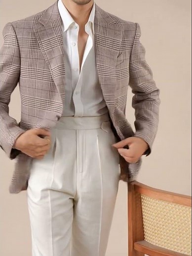 Refined tailoring meets warm-weather ease in our Mens Italian Prince of Wales Check Linen Blazer....