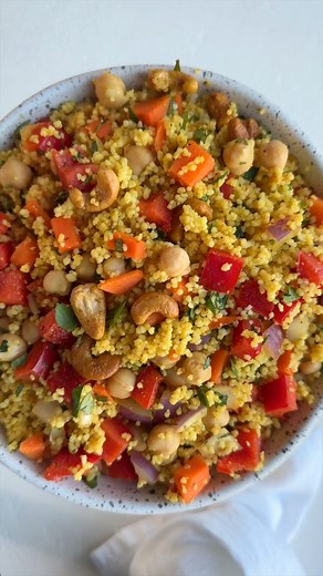 This 15-minute Curried Couscous is rich in plant-based protein and iron, with a flavorful curry dressing. Prep this budget-friendly recipe in advance for a quick and healthy weeknight dinner. It's veggie-loaded and perfect for your weekly rotation. #couscous #curry #salads #couscoussalad #vegansalad #healthychoices #healthyrecipes #healthyvegan #chickpeas | Cooking for Peanuts