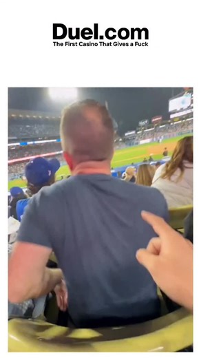 checkmeme.vibe on Instagram: "The video captures a humorous and elaborate prank at a baseball game where a person uses a long, flexible arm extender to give another person the middle finger from behind, creating a chain reaction of confusion and amusement among the spectators. This type of prank aligns with the long-standing tradition of practical jokes in baseball, as evidenced by historical instances like Joe Carter's prank on Derek Bell, which caused an emotional reaction, highlighting how su