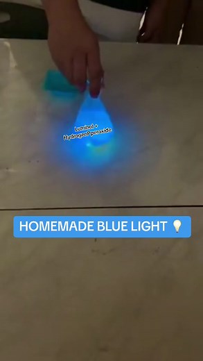 Luminol reacts with Hydrogen Peroxide in a spectacular way producing visible SPECTACULAR BLUE LIGHT 😱‼️ The product of this reaction, an organic peroxide, is very unstable and immediately decomposes with the loss of nitrogen to produce 3-aminophthalic acid with electrons in an excited state. As the excited state relaxes to the ground state, the excess energy is liberated as a photon, visible as blue light - homemade. #bluelight #sciencefacts #sciencememes #experiments #humaninterest
