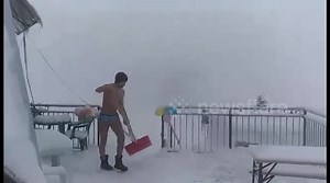 Naked man shovels snow in -10C at Italian resort