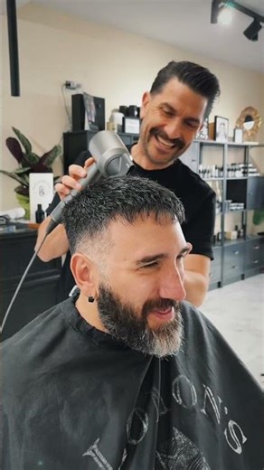 Freestyle haircut: disconnected cut and faded beard to enhance the facial features.