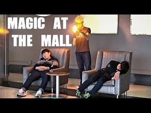 Magician uses tricks to fool people at the mall