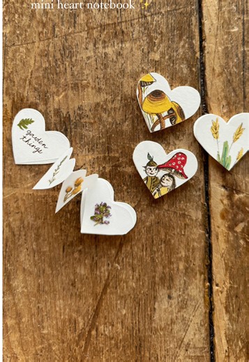 mini heart notebooks 💛 made using upcycled scrap paper. These measure around 1.5” and I used a really easy accordion fold for the inside papers. A sweet size for tiny drawings, adding a valentines message or for gifting treasures! I added pressed flowers that we grew in our garden. #DIY #heartnotebook #diynotebook #upcycling #papercraft #fairycore #valentinesdiy