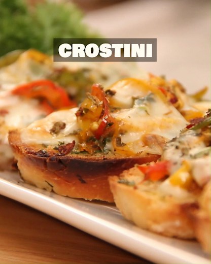 Crispy, cheesy and packed with flavours! This Italian-style Crostini is the perfect appetizer for any occasion. Toasted bread topped with delicious veggies and gooey cheese, simple yet irresistible!😍🧀 Host- Ruchi Bharani Ingredients: French Loaf Red Bell Pepper Yellow Bell Pepper Green Bell Pepper Sliced Baby Corn Tomato Ketchup Pizza Seasoning Chopped Parsley Garlic Paste Salt To Taste Mozzarella Cubes Dry Oregano 1&1/2 tbsp Butter Olive OIl Pepper Copyright- REPL #Crostini #ItalianFlavours #