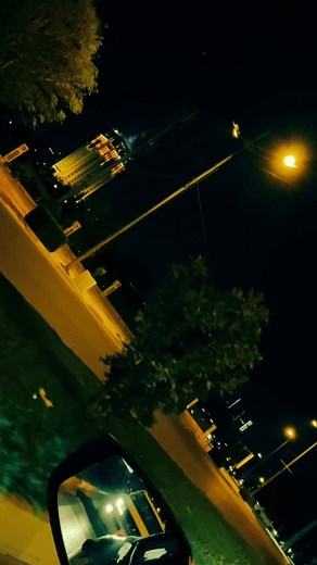 Enchanting Nighttime Urban Street View from a Car