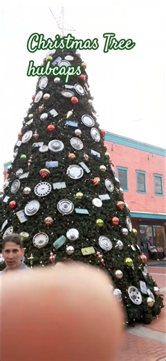 Old Cars Hubcaps Covering This Christmas Tree from all Cars 50s 60s 70s and 80s