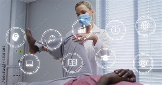 Clinician lifting patient right leg, testing ROM and initiating medical HUD with lens, graph