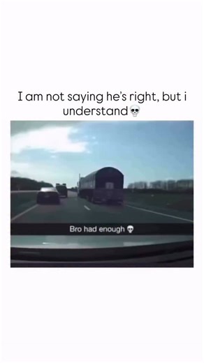 Sarcasm wrrld on Instagram: "The video is a short clip filmed from inside a moving car, looking out at the road ahead. Initially, there are two vehicles in front: a dark sedan in the left lane and a large dark semi-trailer truck in the right lane. The camera car appears to be gaining on them, or perhaps the truck is moving into the right lane from the left. As the camera car approaches, the semi-trailer truck begins to move sharply and aggressively to its left, seemingly cutting off the dark sed