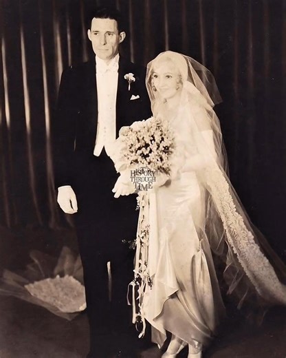 "Bessie Love, silent film star of the 1920s, and William Hawks, a literary agent and brother of acclaimed director Howard Hawks, were photographed on their wedding day at St. James Episcopal Church in Los Angeles, circa December 27, 1929. The ceremony, a modest yet elegant affair, drew several Hollywood figures, reflecting Love’s popularity from films like The Broadway Melody (1929), which had earned her an Academy Award nomination. The couple’s reception followed at the Los Angeles Country Club