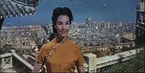 Love Is A Many Splendored Thing The OPriginal Trailer Love Is a Many-Splendored Thing is a 1955 Deluxe color American drama-romance film in CinemaScope. Set in 1949–50 in Hong Kong, it tells the story of a married, but separated, American reporter Mark Elliot (played by William Holden), who falls in love with a Eurasian doctor originally from China, Han Suyin (played by Jennifer Jones), only to encounter prejudice from her family and from Hong Kong society. The film was adapted by John Patrick f