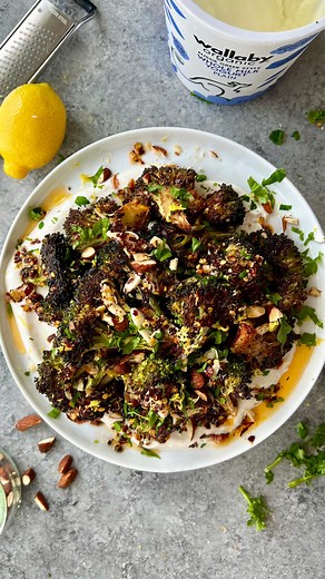 CRISP ROASTED BROCCOLI WITH SIZZLING GARLIC-CHILI OIL AND SPICED YOGURT! Legit amazing…& if you love my veggie dishes make sure you join E-BOOK weekly series (link in bio)! • Broccoli: 1/2 tsp salt 1/2 tsp paprika 1/2 tsp oregano 1/2 tbsp onion granules 2 medium heads broccoli, cut into florets 2-3 tbsp olive oil • Yogurt: 3/4 cup Greek yogurt (I used whole milk) 1/2 tsp cumin 1/2 tsp sugar 1/4 tsp salt Juice of 1/2 lemon • Oil: 4 cloves garlic, thinly sliced into slivers 1/2-1 tbsp red pepper f
