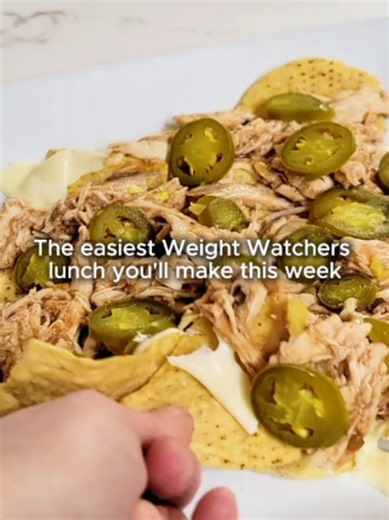 Craving nachos? Try these first. This easy rotisserie chicken nacho recipe with BBQ chicken, cheese, and jalapenos is ready in under 10 minutes! This is the easiest way to stay on track, hit your weight loss goals, and satisfy those cravings! Just 5 Weight Watchers points for this one. Get the full recipe and other low calorie, high satiety ideas at: https://thirtysomethingsupermom.com/rotisserie-chicken-nacho-recipe/ Perfect when you're craving comfort food but don't want to blow your points. �