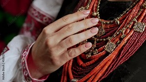 Traditional jewelry necklaces. National costume of Ukraine. Ukrainian woman in authentic ancient coral beads, Zgarda - archaic hutsul neck ornament of status religious purpose