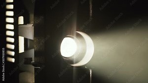 Footage of old film projector filming on black