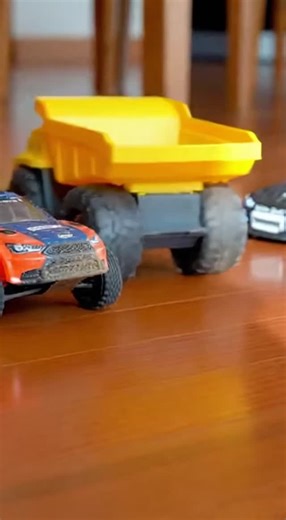 Tiny Race League on Instagram: "Ten seconds of tiny machines throwing big attitude. A rubber‑tired RC rally car bites the corner and knocks a stiff‑wheeled toy dump truck across glossy hardwood while a low‑profile drift car countersteers into a perfect slide. Shot vertically on a smartphone with smooth sideways tracking, bright midday light, and crisp reflections — watch the bump, the skid, and the flawless countersteer. Which one would you take for a spin? Comment below and follow for more micr