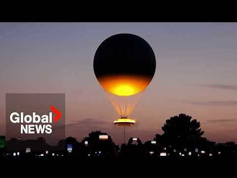 Olympic cauldron rises in hot-air balloon above Paris, delighting onlookers