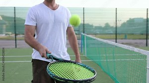 Tennis Racket Hitting a Tennis Ball in Slowmotion