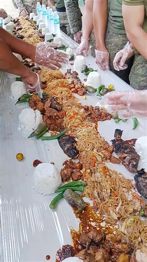 The boodle fight is a cultural phenomenon in the Philippines that symbolizes several values and concepts. Here are some of the symbols associated with boodle fight: *Symbols of Boodle Fight* 1. *Brotherhood and Camaraderie*: Boodle fights symbolize the bond and camaraderie among participants, fostering a sense of unity and togetherness. 2. *Equality and Sharing*: The communal nature of boodle fights emphasizes equality among participants, regardless of rank, status, or background. 3. *Filipino C