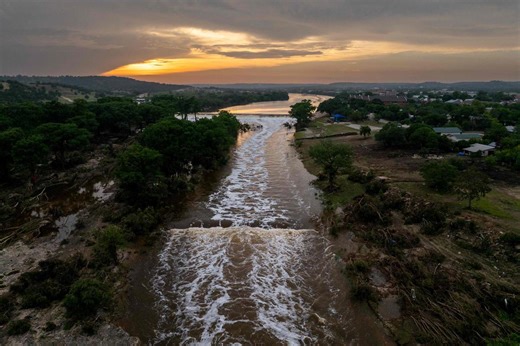 Rescuers on horseback and with dogs search for Texas flood victims