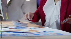 Marketing manager opening an envelope and revealing a new credit card, showcasing excitement and anticipation for future purchases