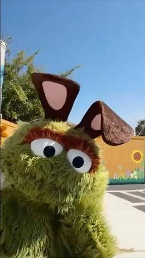 Oscar the grouch dressed up for eater at Sesame Street place