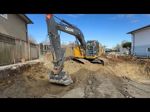 Excavator Digging A House Foundation