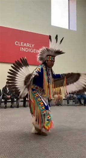 Native American Eagle Dance performed inside a large, high-ceilinged museum hall