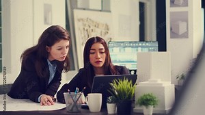 Industrial engineers designing floor plan sketch on cad software, using laptop to determine measurements of apartment for remodeling projects. Architects working at unicorn business office.