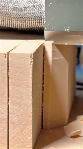 Using A Sharp Wood Chisel To Carefully Pare And Smooth The Surface Of A Large Wooden Block