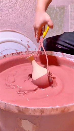 Carefully Dipping a Mold into Liquid Material to Create a Smooth and Perfect Shape