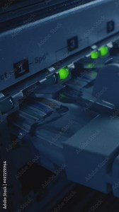 Macro Shot: Ethernet Cables Connected to Router Ports with Blinking Lights. RJ45 Internet Connectors Plugged into Modem LAN Switches. Side View Moving Camera. Vertical Screen Orientation Video 9:16.