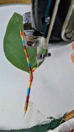 Colorful Thread Embroidery on a Long Leaf 🌿🌈🧵 #EmbroideryArt #ColorfulEmbroidery #Shorts